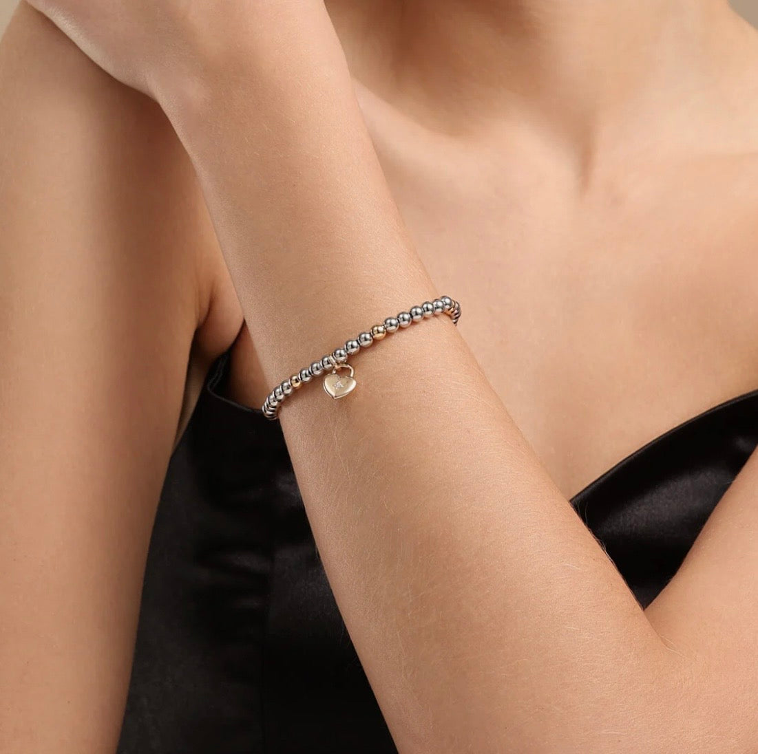 Elasticated Mix-Metal Bracelet with Heart Lock Charm - NOSTRUM